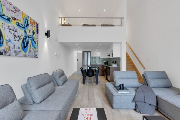 Living room: Features 4 full sofa beds and a Smart HD TV with access to Netflix, Disney+, and Prime.