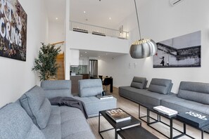 Living room: Features 4 full sofa beds and a Smart HD TV with access to Netflix, Disney+, and Prime.