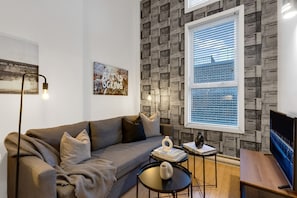 Living Room: Features 1 sofa beds and a Smart HD TV. Log in to your favorite streaming services like Netflix, Disney+, and Prime.