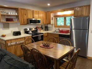 stainless steel appliances, well appointed kitchen, table expands to seat 8