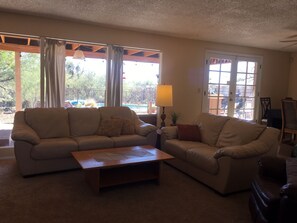 Light and bright living room with leather sofas