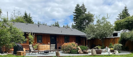 West Coast style, sauna, cedar soaker tub surrounded by nature & waterfall pond.