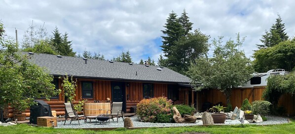 West Coast style, sauna, cedar soaker tub surrounded by nature & waterfall pond.