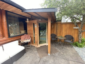 Relax & unwind in our Far infra red sauna  overlooking our waterfall pond