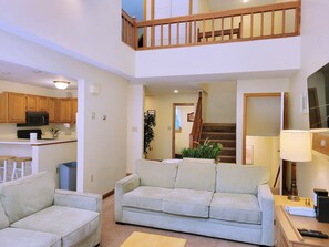 Living area looking towards entry and stairways