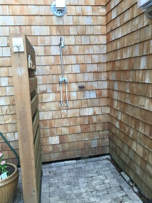 An outdoor shower to wash off sandy toes.