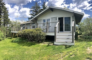 From the lawn, The Studio has a large expansive back deck.