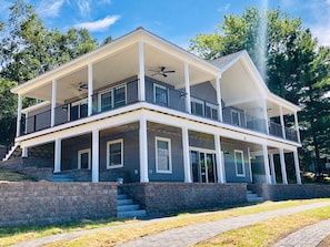 When walking into this beautiful home you will use the sliding glass doors on the bottom level.