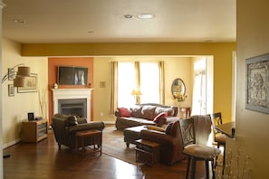 The main living room with gas fireplace and comfy furniture great place to hang