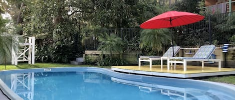 Private pool in lush garden setting