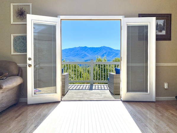 Incredible view of Mt LeConte in Great Smoky Mountains National Park through French doors in living room of Mountainview Majesty.
