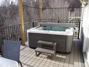 You'll fully relax in our 7-person hot tub situated on the middle deck with mountain views!