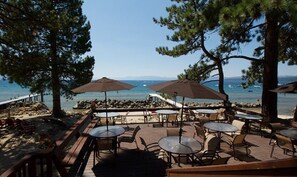 Dining patio near pool, overlooking private beach