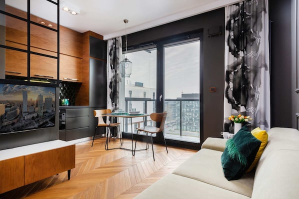 Living room with a comfortable sofa and TV.