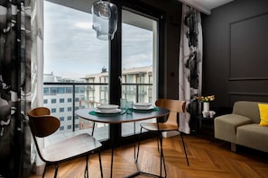 Large table with chairs for eating communal meals.