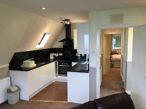 Compact kitchen area | Thistle Lodge - Flowerburn Holidays, Rosemarkie, near Fortrose