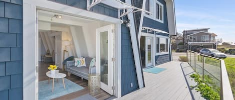 The 2-bedroom, unit wide french door entrance and outdoor pathway.