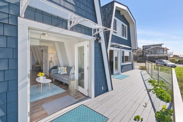 The 2-bedroom, unit wide french door entrance and outdoor pathway.