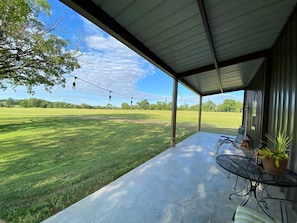 Patio with hanging lights and outdoor furniture