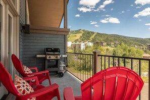 Grill & chill on the private deck with sweeping resort views