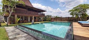 View of pool and villa facing north