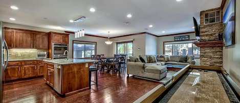 With this incredible open floor plan, you and your loved ones won't have to choose between playing a game of shuffle board, keeping an eye on dinner, and chatting by the fireplace