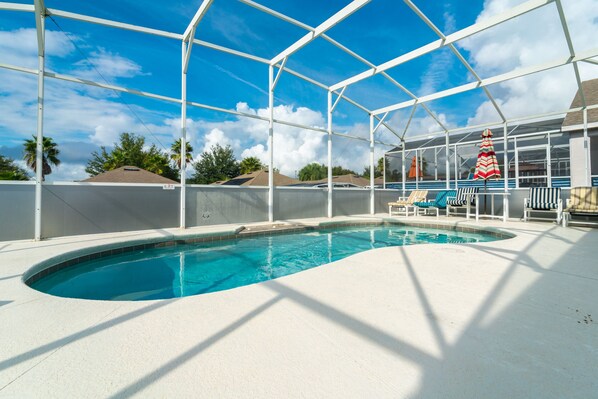 View of pool area.  Pool screen has opaque privacy panels