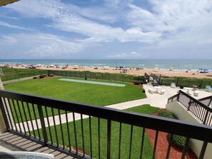 View from balcony.  Large fenced-in yard for kids, right in front of balcony.