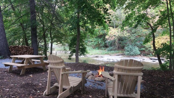 "The best part of this place is the backyard. Sitting next to the river, watching the fire was real FUN! It felt like camping without the inconvenience of real camping.." ...Lina   (no fee for firewood)