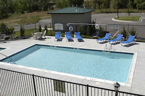 Lounge by the pool in the sunshine.