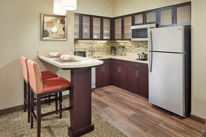 Prepare meals in the kitchen