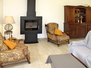 Living Room, Room, Wood-Burning Stove, Furniture, Hearth, Fireplace, Property, Interior Design, Floor, Couch