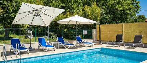 Water, Plant, Property, Sky, Furniture, Swimming Pool, Umbrella, Blue, Chair, Azure