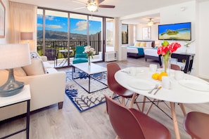 Have a comfortable stay in this beautiful condo with a stunning Diamond Head view, a pull-out sleeper sofa, a dining table with 4 chairs, a coffee table, a chair, and a flat-screen TV.