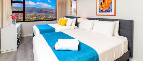 Relax in your bedroom with full and queen-size beds, a ceiling fan, and the beautiful Diamond Head view!