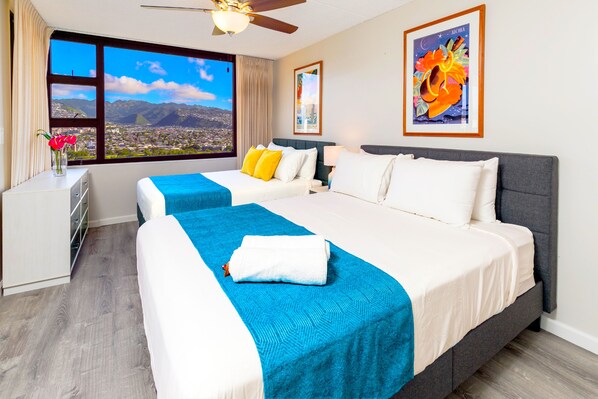 Relax in your bedroom with full and queen-size beds, a ceiling fan, and the beautiful Diamond Head view!