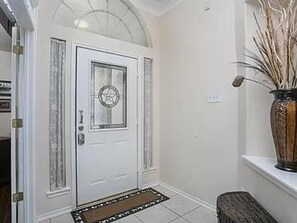 The ceramic tile entry way welcomes you home