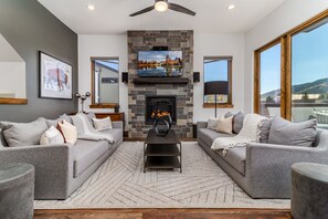 Living Room w/Gas Fireplace + Gus Modern  Flipside Queen Sofas.