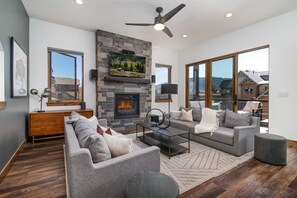 Living Room w/Gas Fireplace and walk-out patio w/Weber Grill.