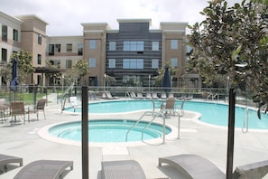 Dive into the outdoor pool on a hot summer day.