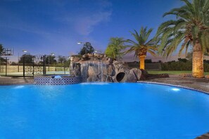 This outdoor oasis offers a serene and visually stunning experience, combining the refreshing allure of the pool with the soothing sounds of a waterfall.