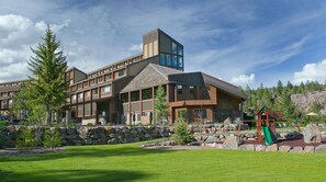 Main Tamarron Lodge - Main Lodge at Tamarron Lodge. Outdoor pool, grassy area, and playground.