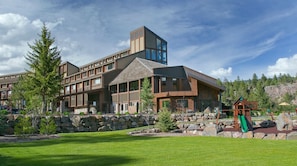 Main Tamarron Lodge - Main Lodge at Tamarron Lodge. Outdoor pool, grassy area, and playground.