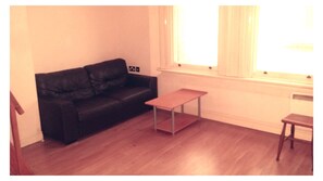 Bright living space with views onto the cobbled alley.