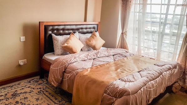 Queen size bed with orthopedic mattress.