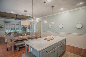 View of the kitchen, dining, and living areas.