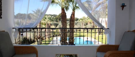 Large balcony overlooking the communal pool, beautiful views