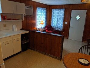 Kitchen and view of front door. Bedrooms are to the right of this picture.