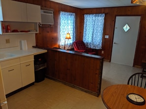 Kitchen and view of front door. Bedrooms are to the right of this picture.