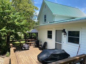 Back deck with BBQ, seating area and small fire pit (2 more on property)